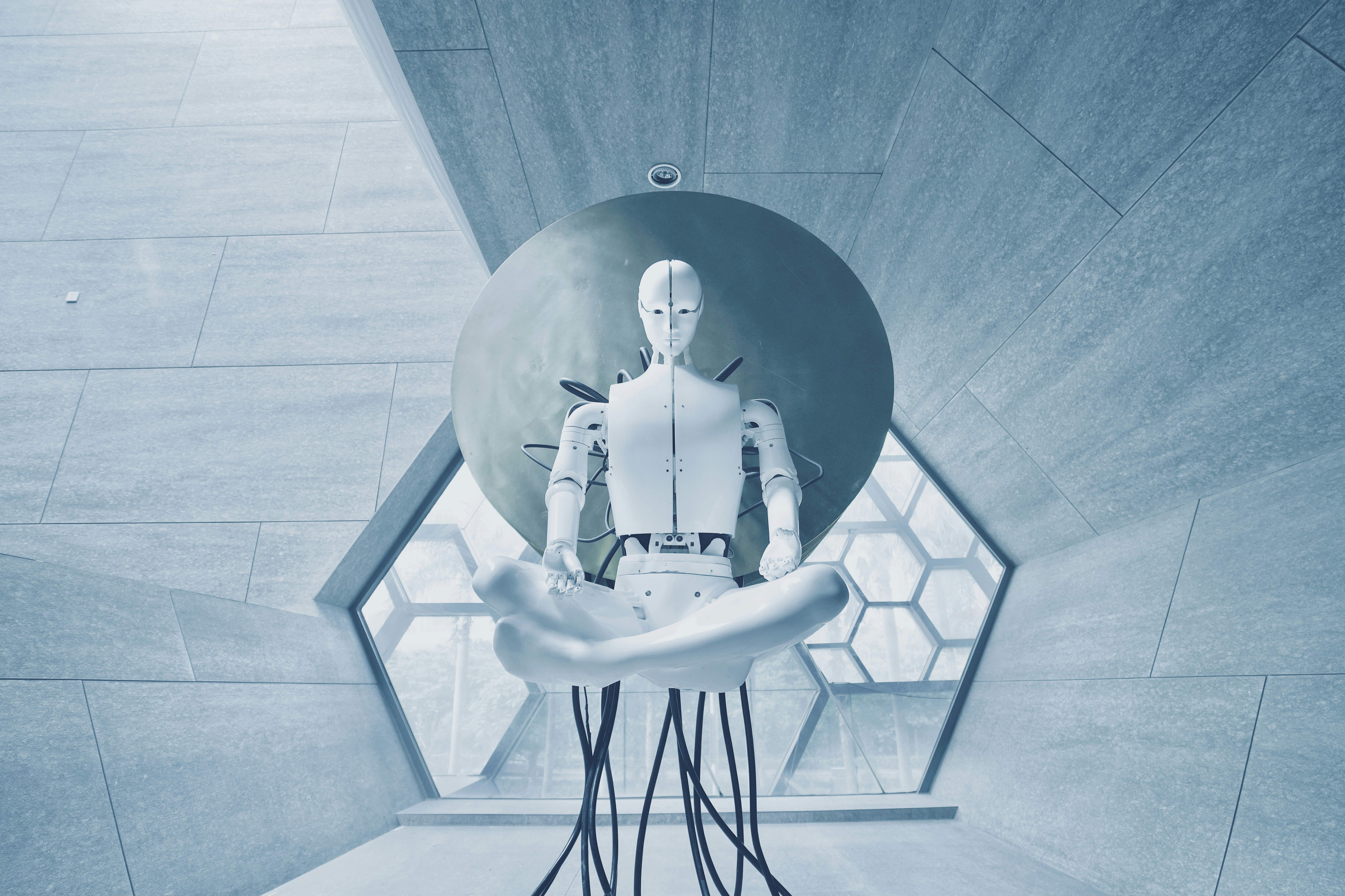 A robot seated on a chair